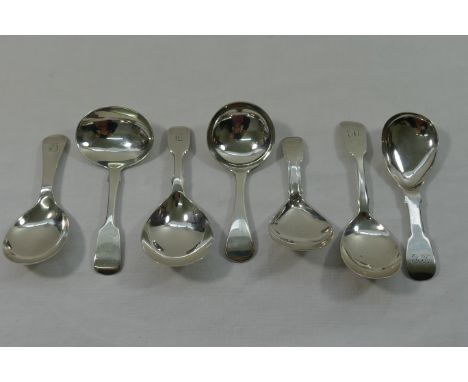 A collection of seven 19th century assorted silver caddy spoons,  London 1817 by William Batman, London 1829 and 1830 by John