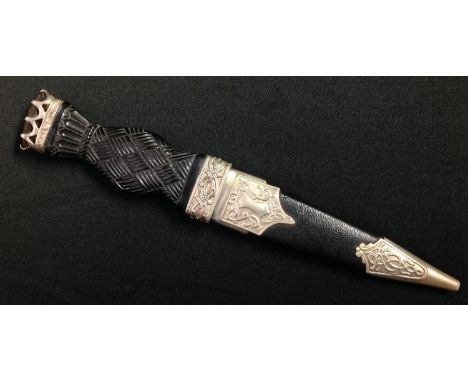 Scottish Sgian-dubh Knife with 85mm long single edged blade with fuller and notched decoration to upper edge of blade. No mak