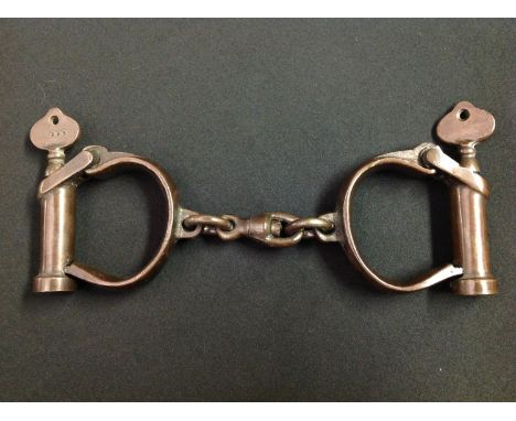 WW2 British Army Military Police issue Handcuffs. Serial numbered "352" Maker marked and dated "RSC 1945". Also WD Broad Arro