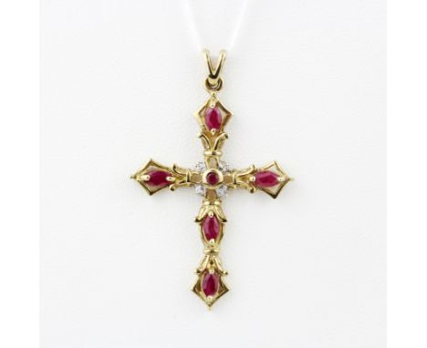 A large hallmarked ruby and diamond set cross pendant, 4.5 x 2.8cm. Gross weight approx. 4.3gr.