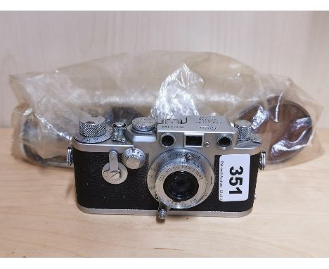 A Leica 811 159 camera and accessories.