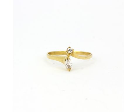 A yellow metal (tested 18ct gold) ring set with a marquise and a brilliant cut diamonds, (N).