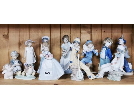 A group of Nao and other porcelain figures.