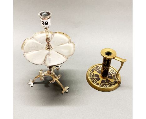 An Arts and Crafts silver plated candlestick together with an Arts and Crafts brass and rosewood chamber stick by Fisher of T