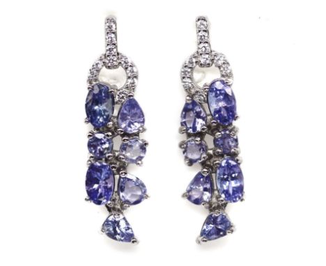 A pair of 925 silver drop earrings set with mixed cut tanzanites and white stones, L. 2.6cm.