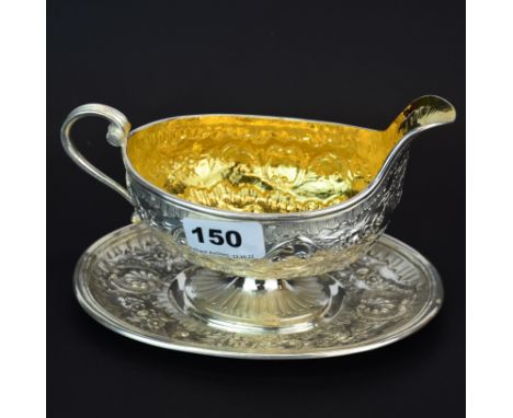 A superb early French hallmarked silver and gilt lined saucier, L. 19cm. H. 12cm.