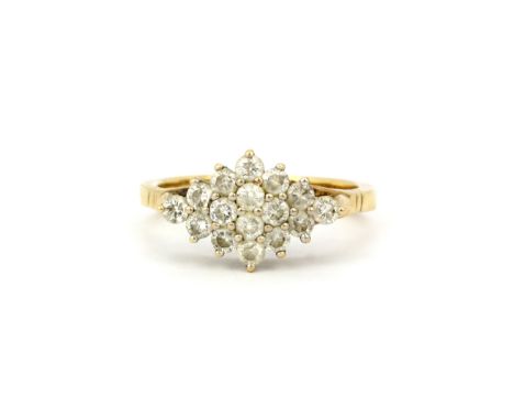 A hallmarked 9ct yellow gold diamond set cluster ring, approx. 0.80ct total, (R.5). Gross weight approx. 3.9gr.