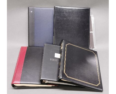 A group of first day covers, some with coins.