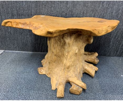 An interestinvoice rustic tree trunk coffee table, W. 95cm. H. 44cm.