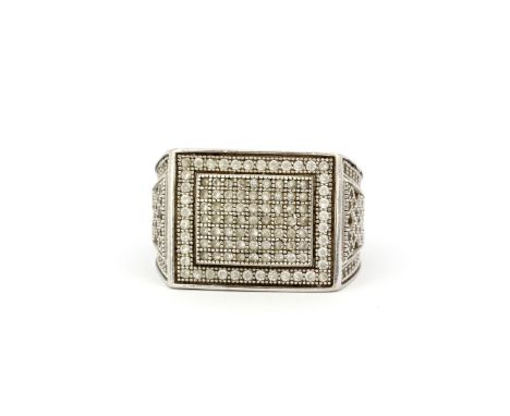 A heavy gent's 925 silver ring set with cubic zirconias, (S).