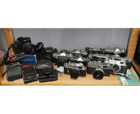 A group of mixed vintage cameras.