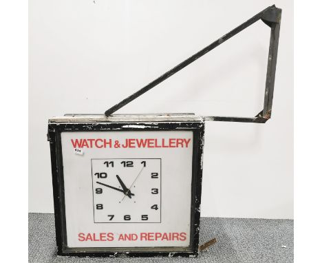 A large vintage exterior shop advertising clock, clock size 65 x 62 x 27cm.