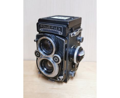 A Rolleiflex twin lens reflex camera.