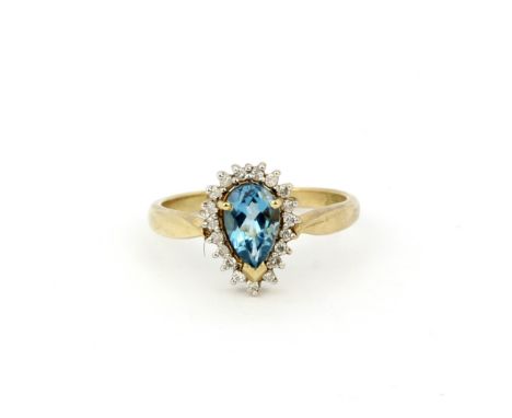 A hallmarked 9ct yellow gold ring set with a pear cut blue topaz surrounded by diamonds, (S.5). Gross weight approx. 3.7gr.