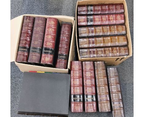 A large group of stamps and first day covers in large ledger albums.