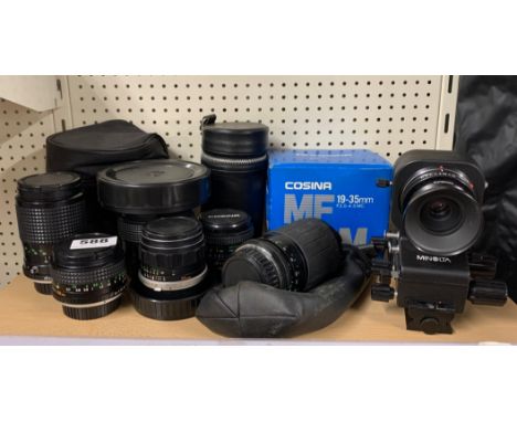 A group of mixed camera lenses.