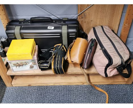 A group of mixed camera equipment.