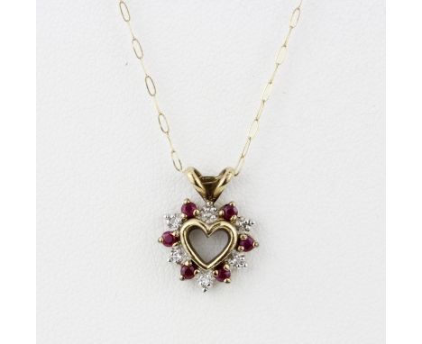 A hallmarked 9ct yellow gold diamond and ruby set heart pendant on a 9ct yellow gold chain, L. 42cm.