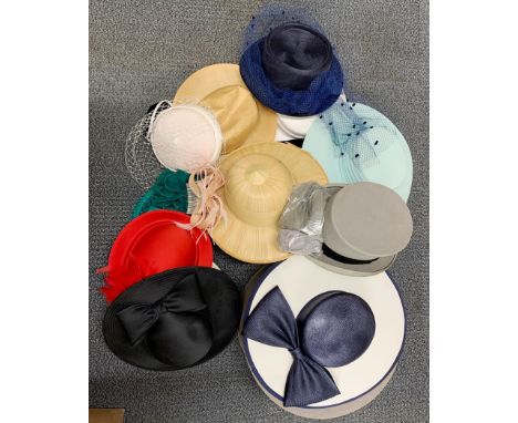 A collection of vintage ladies' hats and hat box.