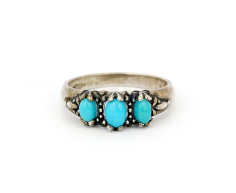 A 925 silver ring set with oval cabochon turquoise, (T.U).