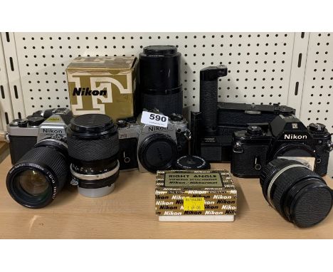 A group of Nikon cameras, camera body's and lenses.
