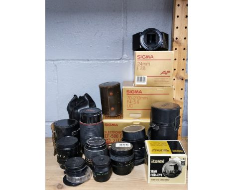 A group of mixed camera lenses.