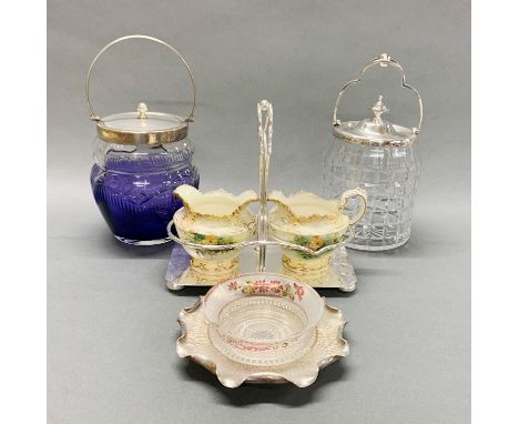 Two silver plate and cut glass biscuit barrels together with a silver plate and porcelain strawberry set and a  silver plate 