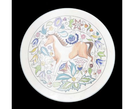 Poole Pottery charger, decorated with a young horse among stylised flowers, factory stamp and initialled 'K' to the underside