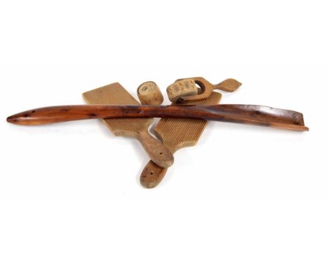 Pair of treen butter pats, a mould in the form of a thistle, a floral patterned roller and a&nbsp;Yew wood shoe/boot horn,&nb