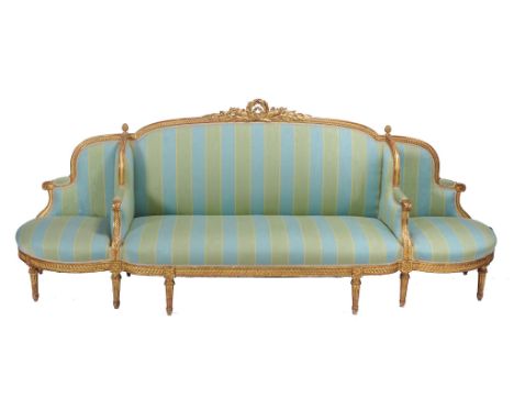 A carved giltwood framed sofa in Louis XVI style, second half 19th century   A carved giltwood framed sofa in Louis XVI style