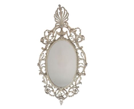 A George III carton pierre wall mirror, circa 1770   A George III carton pierre wall mirror,   circa 1770, the oval plate wit