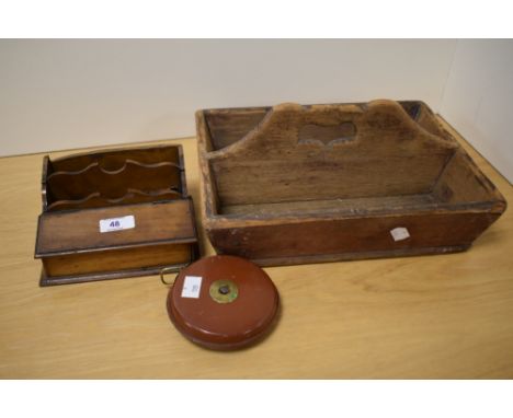 A 19th Century pine cutlery tray, measuring 33cm long, a vintage leather measuring tape, and a Victorian mahogany desk stand