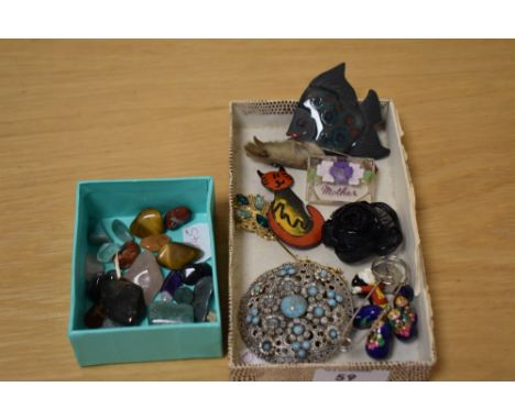 An assortment of costume jewellery brooches and pins including a large paste set brooch of a pierced floral design, a double 