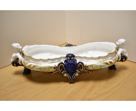 A Royal Worcester porcelain centre piece of waisted form, having duck egg blue and Royal blue ground with gilt heightening, C