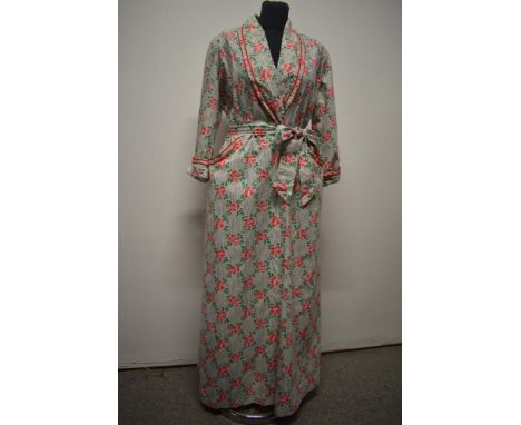 A 1940s/50s cotton housecoat, having bright rose pattern on grey striped white ground, with shoulder pads, pockets to front a