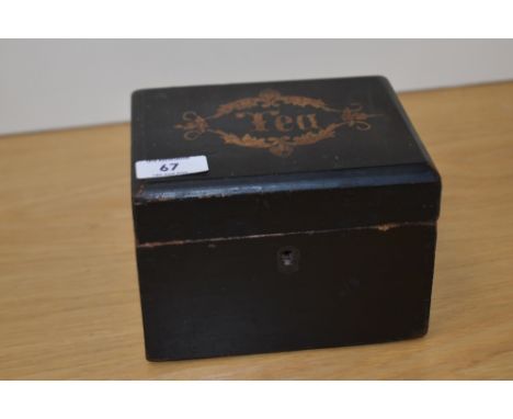 A 19th Century ebonised tea caddy, of rectangular form, with inlaid 'Tea' design to the lid, measuring 12cm x 16cm x 12cm