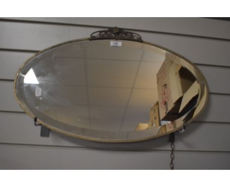 A vintage Art Deco style bevelled wall mirror 61cm x 38cm.