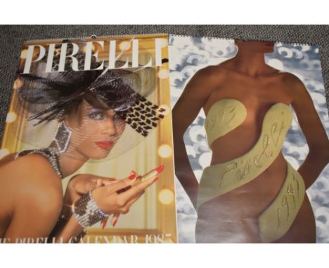 Eighteen vintage Pirelli calendars, 1984 all the way through to 2001, with boxes.