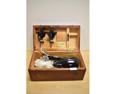 An interesting vintage Walker's Knotmaster nautical instrument for mileage, displayed within a pine box