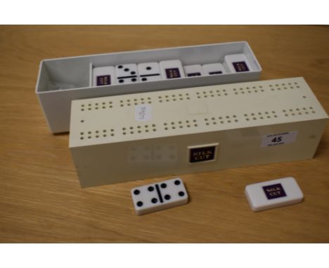 A set of vintage Silk Cut dominoes and cribbage board