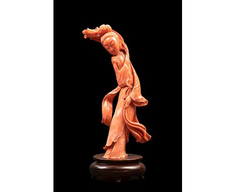 h cm 28Finely carved, depicting an elegantly dressed woman with elaborately adorned hair, holding flowers. Weight: g 1.033.Pr