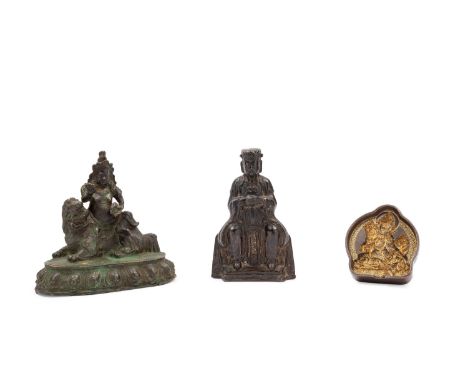 The larger h cm 15 x l cm 15,5A bronze sculpture with traces of lacquer and gilding depicting a dignitary; a sculpture repres