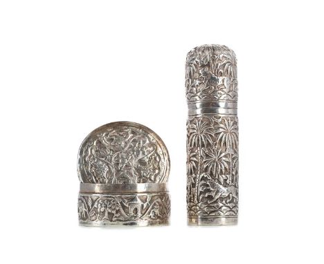 SOUTH EAST ASIAN WHITE METAL VANITY JAR AND LIDDED BOX,both repousse decorated with typical flora and fauna, the box with fur