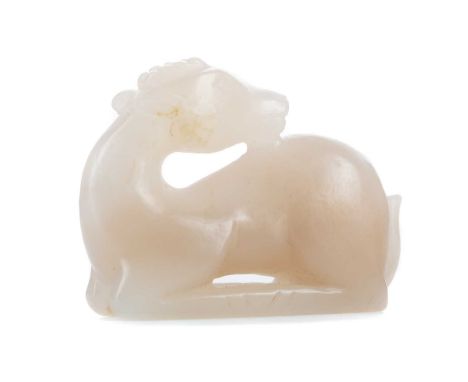 CHINESE WHITE JADE DEER CARVING,modelled in recumbent pose, 5.3cm longSome light general surface wear, in keeping with age. I