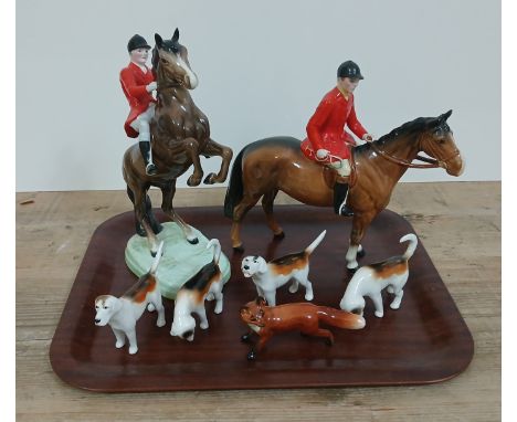Beswick hunting set comprising brown horse and rider, rearing horse and rider, four hounds and fox.Condition:- crazing throug