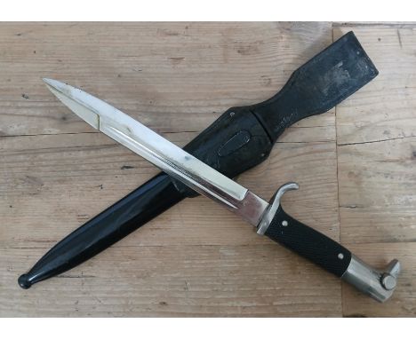 A German Third Reich K98 Parade bayonet by Anton Wingen, blade length 19cm, textured black bakelite grip, metal scabbard and 