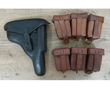 A German WWII era black leather Luger Holster and ammunition pouches. 