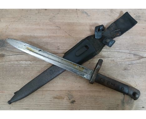 A WWI Austo-Hungarian bayonet, blade length 25cm, metal scabbard and leather frog, total length 38cm.