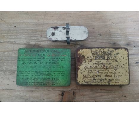 Two WWII Anti-Gas Ointment tins and another military first aid kit. 