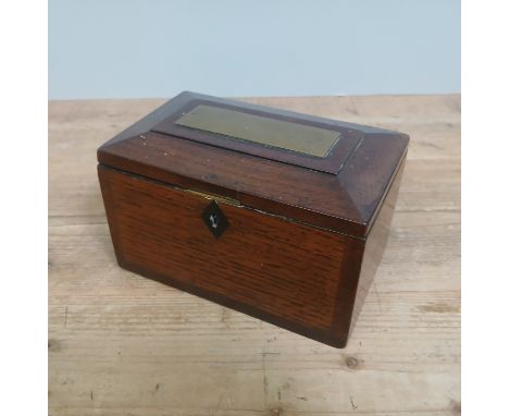 A 19th century oak tea caddy, sarcophagus form with brass plaque 'Mary Meredith ...... 1831', length 19cm.